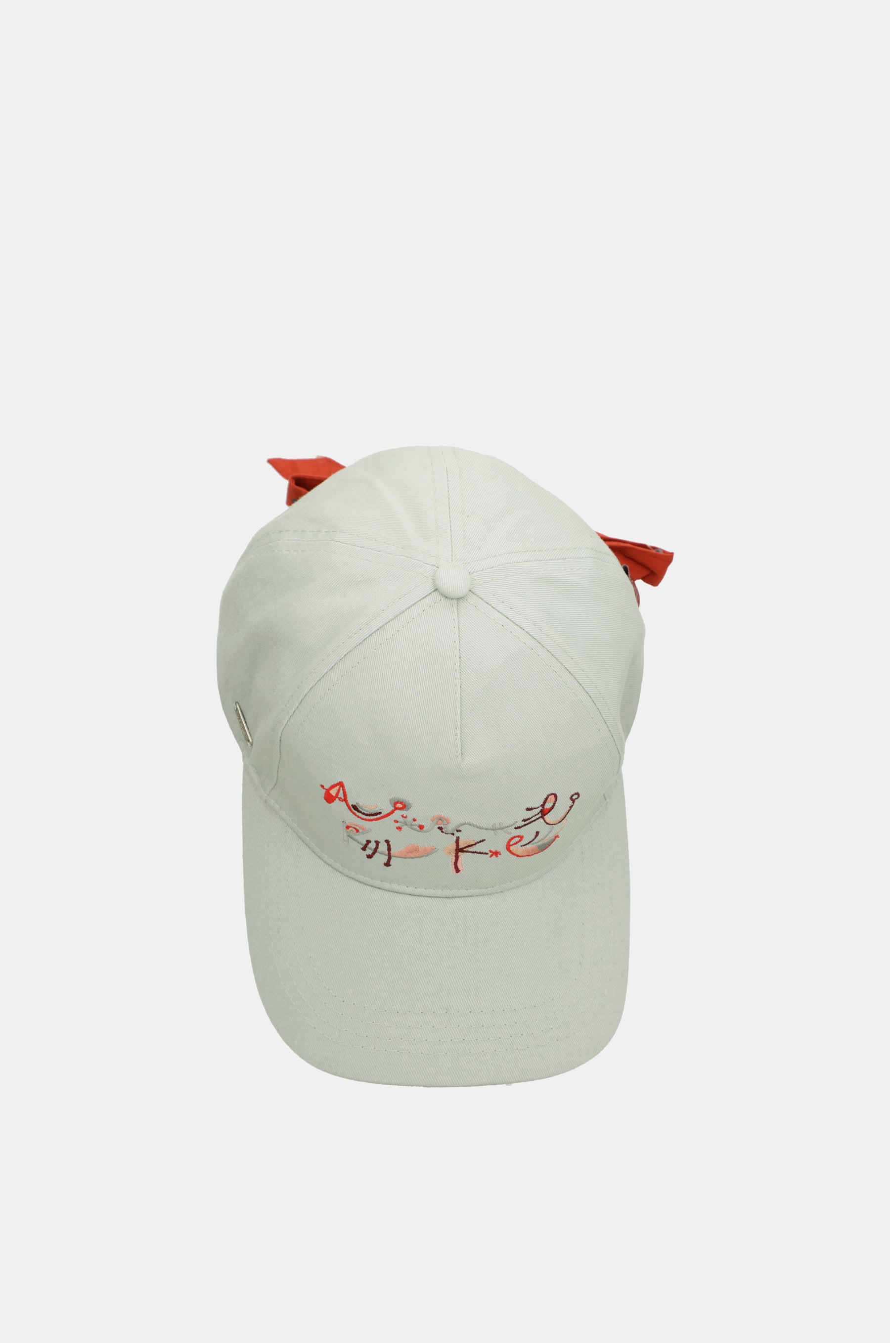Green cap with red bow