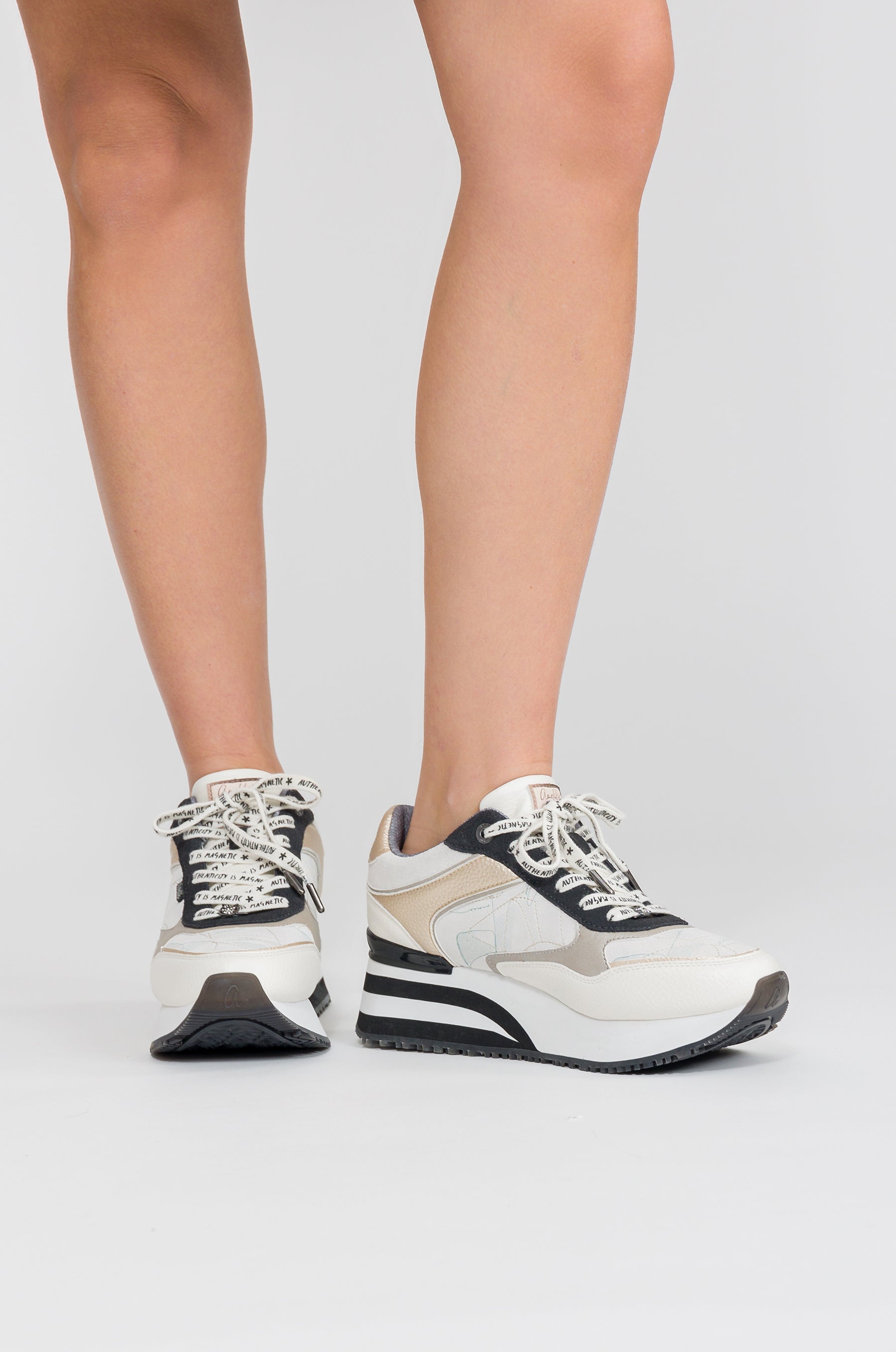 White sneakers with black details